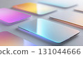 Glowing smartphones with color gradients resting on minimalist white surface, demonstrating wireless charging and cutting-edge mobile technology design 131044666