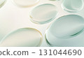 Translucent oval forms overlapping, generating ethereal geometric composition with soft luminosity, representing contemporary minimalist aesthetic and visual serenity 131044690