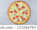 Caesar Salad Style Pizza with Bacon, Lettuce, Cherry Tomatoes, Parmesan and Creamy Dressing on Gray Stone Background 131044765