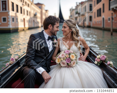 Happy couple in wedding attire smiling in Venetian gondola at dusk. Ideal for romance-themed content, luxury travel ads, and wedding inspiration. Radiates joy and intimacy 131044851
