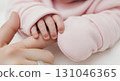Blank pink baby mittens worn mockup, close-up, isolated 131046365