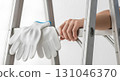 Blank safety gloves gripping ladder rung, isolated 131046370