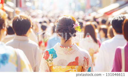 Back view of a woman wearing a yukata in the crowd at a festival 131046611
