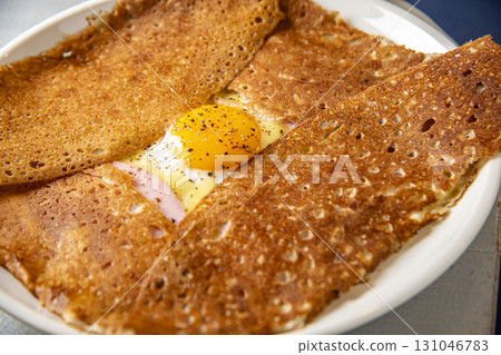 A delicious galette with the aroma of fragrant buckwheat flour A delicious galette with the aroma of fragrant buckwheat flour 131046783