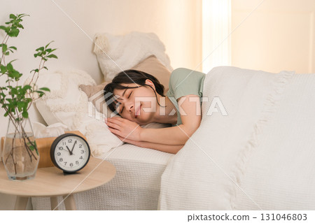 Young Asian woman sleeping in bed (sleep, sound sleep, sleep time, good sleep) Young Asian woman sleeping in bed (sleep, sound sleep, sleep time, good sleep) 131046803
