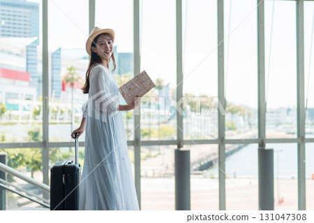 A young woman who enjoys traveling 131047308