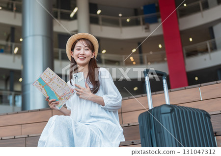 A woman planning a trip 131047312