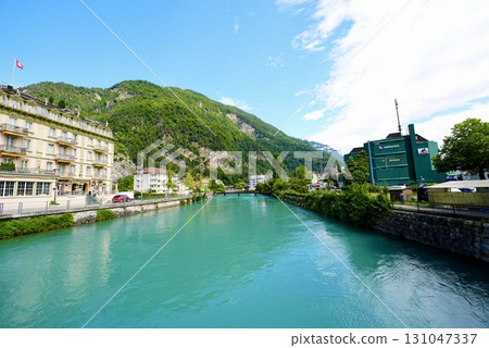 Beautiful river scenery in Interlaken. A spectacular Swiss landscape interwoven with clear water and nature. Beautiful river scenery in Interlaken. A spectacular Swiss landscape interwoven with clear water and nature. 131047337