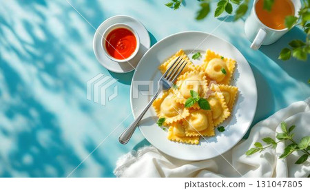 Plate of fried ravioli adorned with tomato sauce and cheese, a delightful summer food option 131047805