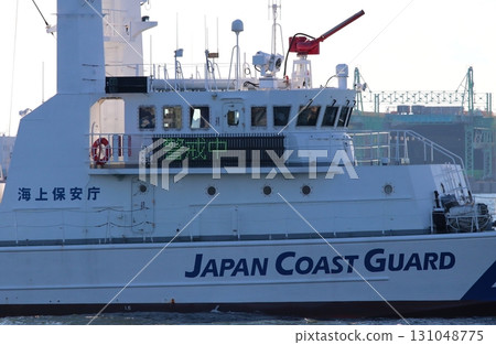 A part of a Japan Coast Guard patrol boat with a "On Alert" sign posted on the bridge. A part of a Japan Coast Guard patrol boat with a "On Alert" sign posted on the bridge. 131048775