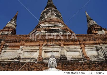 Pagoda and Buddha statue at Wat Yai Chai Mongkhon in Ayutthaya, Thailand Pagoda and Buddha statue at Wat Yai Chai Mongkhon in Ayutthaya, Thailand 131048857