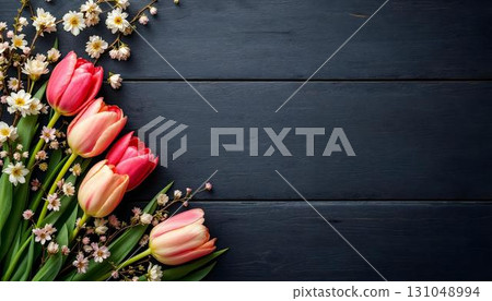 Spring flowers showcased against a weathered wooden background, embodying the essence of a vibrant spring season 131048994