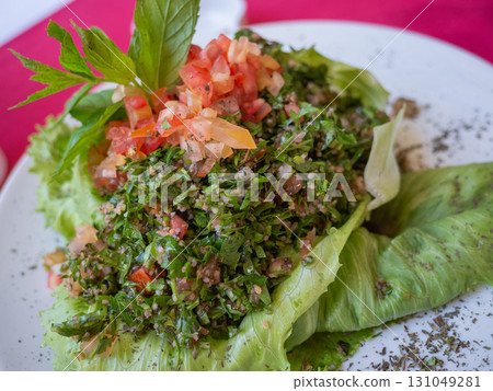 [Jordan] Arabic salad with tomatoes and mint served at a restaurant in Jerash 131049281
