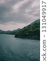 A bay connecting the cloudy sky, sea, and island 131049917