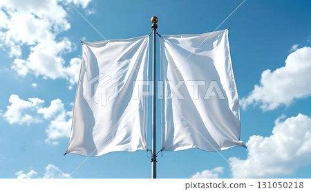 Vertical mockup of two white flags waving in the breeze under a bright blue sky 131050218