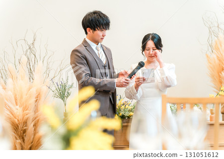 Bride reading a letter to her parents at her wedding (Bride's letter) Bride reading a letter to her parents at her wedding (Bride's letter) 131051612