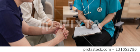 Adult Asian doctor medical consultation home visit patient care health guidance support 131052786