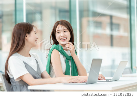 A university student operating a computer in a university classroom 131052823