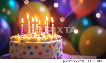 birthday cake with candles and blurred color balloons background 131053090