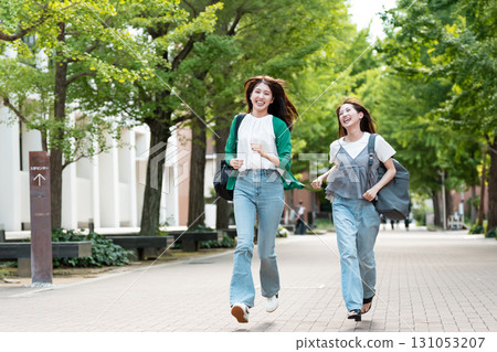 University campus female college student running 131053207
