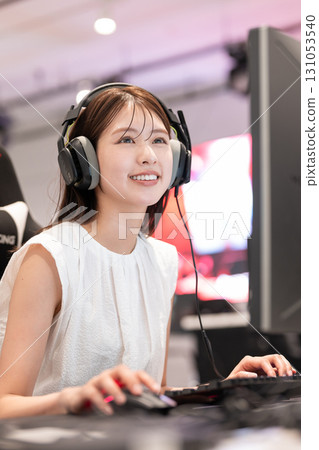 Young woman enjoying games at an e-sports tournament 131053540