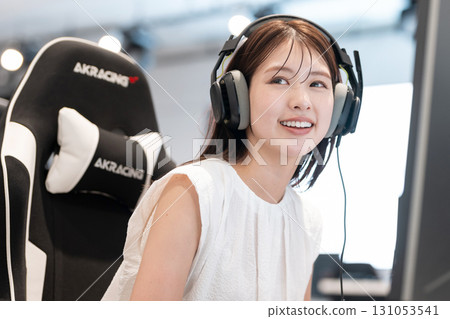 Young woman enjoying games at an e-sports tournament 131053541
