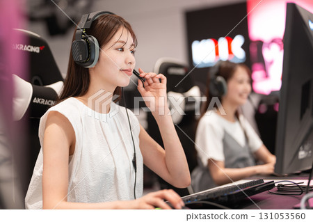 Young woman enjoying games at an e-sports tournament Young woman enjoying games at an e-sports tournament 131053560