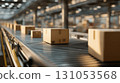 Side view of a conveyor line in a logistics warehouse transporting cardboard boxes 131053568