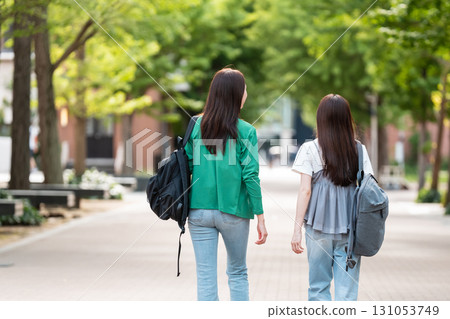 Female college student walking on university campus Female college student walking on university campus 131053749