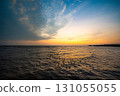 Picture of the atmosphere of the sea in the evening, the light and color of the sky are beautiful. 131055055