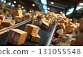 A large number of cardboard boxes and piles of luggage moving along the conveyor belt in a logistics warehouse 131055548