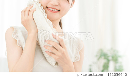 Young Asian woman washing her face and drying it with a towel (face wash) Young Asian woman washing her face and drying it with a towel (face wash) 131056640
