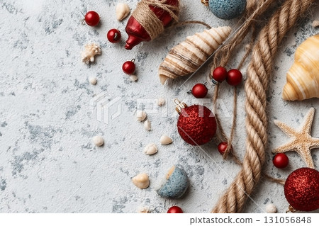 Rope, shells and Christmas decor on white grunge background. Top view Rope, shells and Christmas decor on white grunge background. Top view 131056848