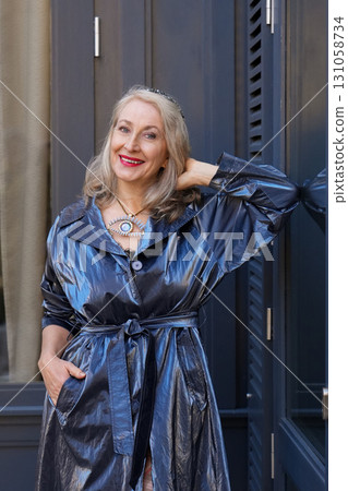 Attractive grey-haired woman in her sixties in a blue jacket Attractive grey-haired woman in her sixties in a blue jacket 131058734