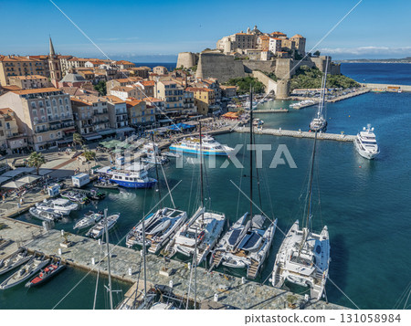 Aerial view Citadel of Calvi Upper Corsica French maritime stronghold in the Mediterranean Sea with defensive walls Aerial view Citadel of Calvi Upper Corsica French maritime stronghold in the Mediterranean Sea with defensive walls 131058984