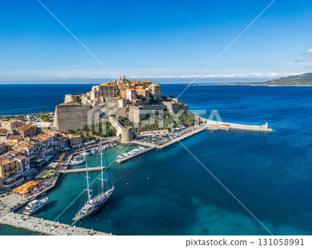 Aerial view Citadel of Calvi Upper Corsica French maritime stronghold in the Mediterranean Sea with defensive walls Aerial view Citadel of Calvi Upper Corsica French maritime stronghold in the Mediterranean Sea with defensive walls 131058991