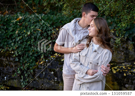 Young Cute Female Hugs Boyfriend. In Autumn Outdoor. Lovers Walking in Park. Attractive Funny Couple. Lovestory in Forest. Man and Woman. Cute Lovers in the Park. Family Concept. Happy Couple. Young Cute Female Hugs Boyfriend. In Autumn Outdoor. Lovers Walking in Park. Attractive Funny Couple. Lovestory in Forest. Man and Woman. Cute Lovers in the Park. Family Concept. Happy Couple. 131059587