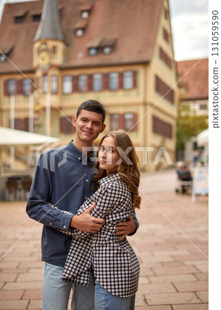 Young Cute Female Hugs Boyfriend. In Autumn Outdoor. Lovers Walking in Park. Attractive Funny Couple. Lovestory in Forest. Man and Woman. Cute Lovers in the Park. Family Concept. Happy Couple. 131059590