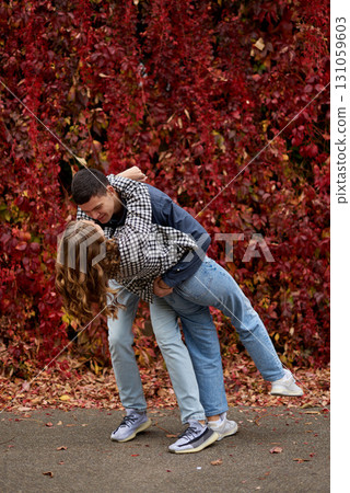Young Cute Female Hugs Boyfriend. In Autumn Outdoor. Lovers Walking in Park. Attractive Funny Couple. Lovestory in Forest. Man and Woman. Cute Lovers in the Park. Family Concept. Happy Couple. Young Cute Female Hugs Boyfriend. In Autumn Outdoor. Lovers Walking in Park. Attractive Funny Couple. Lovestory in Forest. Man and Woman. Cute Lovers in the Park. Family Concept. Happy Couple. 131059603