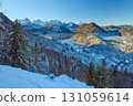 View of snowy mountain landscape with lake and mountains near Neuschwanstein Castle, capturing early morning light in beautiful winter area, showcasing detailed high-quality photograph of icy 131059614