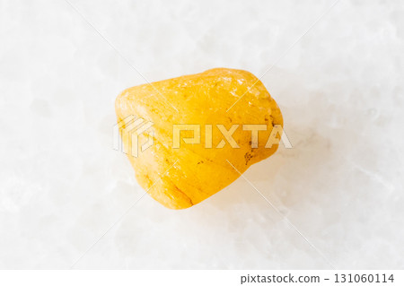 sample of raw yellow sapphire crystal on white 131060114