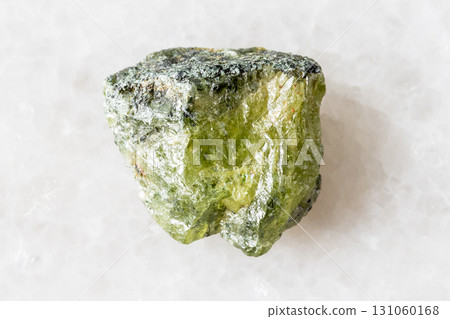 sample of rough green sphene mineral on white sample of rough green sphene mineral on white 131060168