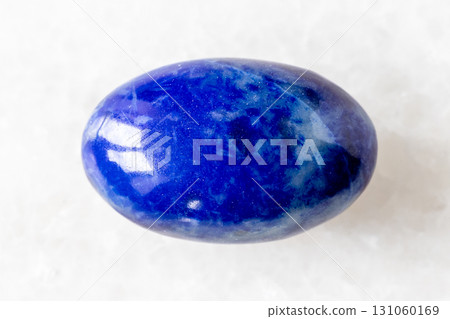 sample of polished lapis lazuli mineral on white sample of polished lapis lazuli mineral on white 131060169