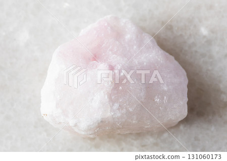 sample of raw pink aragonite rock on white marble sample of raw pink aragonite rock on white marble 131060173