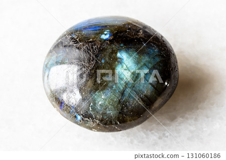 sample of polished labradorite mineral on white sample of polished labradorite mineral on white 131060186