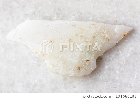 sample of polished white nephrite rock on white 131060195