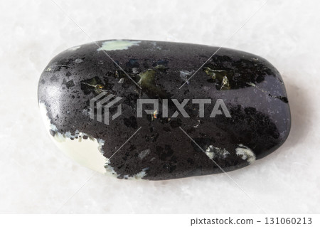 sample of polished teyskiy jade mineral on white 131060213