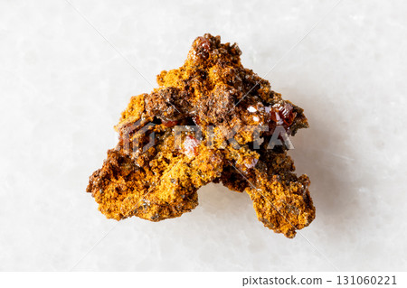 sample of raw wulfenite rock on white marble 131060221