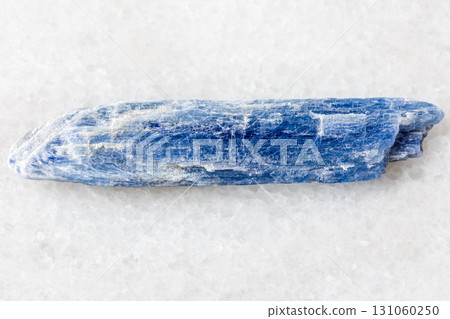 sample of raw blue kyanite crystal on white marble sample of raw blue kyanite crystal on white marble 131060250