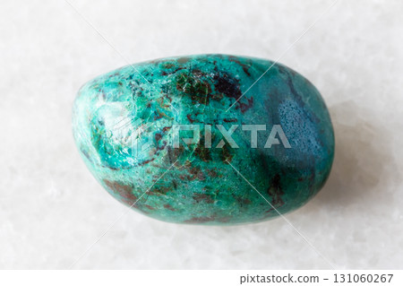 sample of tumbled chrysocolla mineral on white 131060267